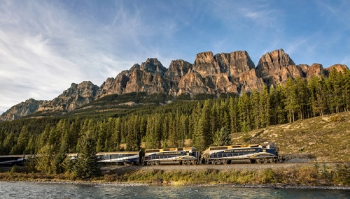 RM first passage to the west rocky mountaineer train passes by castle mountain
